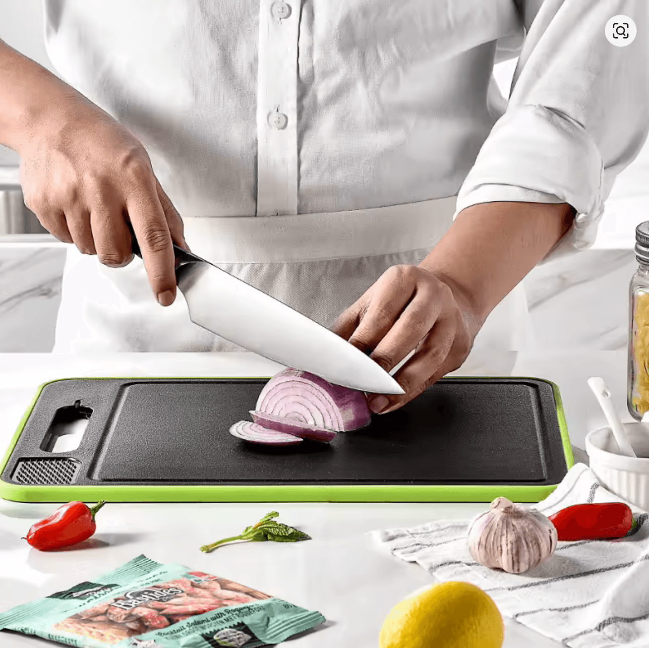 Chef slicing onions on the ThawPrep board